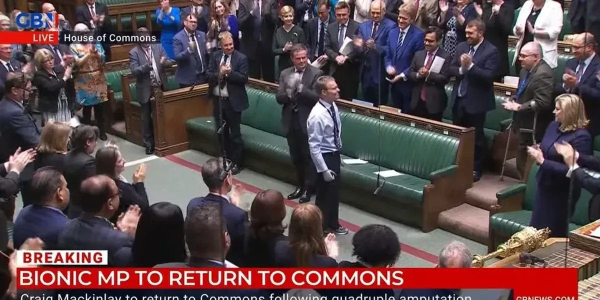 MPs burst into applause as 'bionic' MP Craig Mackinlay given
standing ovation on Commons return